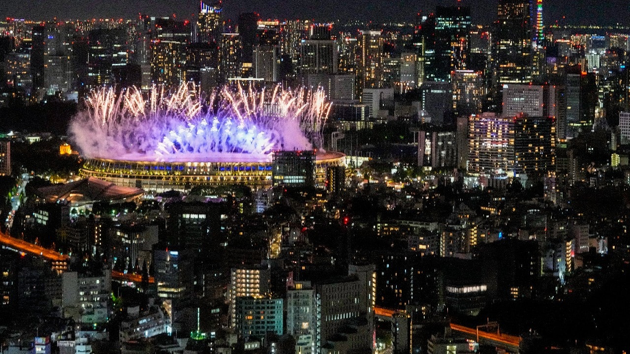 Fireworks illuminate over the National Stadium during the opening ceremony of 2020 Tokyo Olympics views from Shibuya Sky observation deck. (Image: AP)