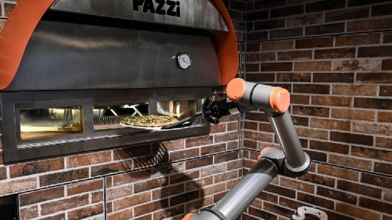 The robots are also seen as an answer to chronic labour shortages in restaurants and food service -- in many countries owners are struggling to rehire workers furloughed in Covid lockdowns, since many are abandoning the sector's long and stressful hours. (Image: AFP)
