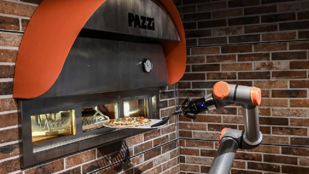 But even if robots start supplementing cooks in the kitchen, Pazzi has no intention of trying to replace traditional pizza cooks entirely. (Image: AFP)