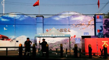 Security guards outside a 'vocational skills' centre in Xinjiang on Sept 3, 2018. (Image: Reuters)