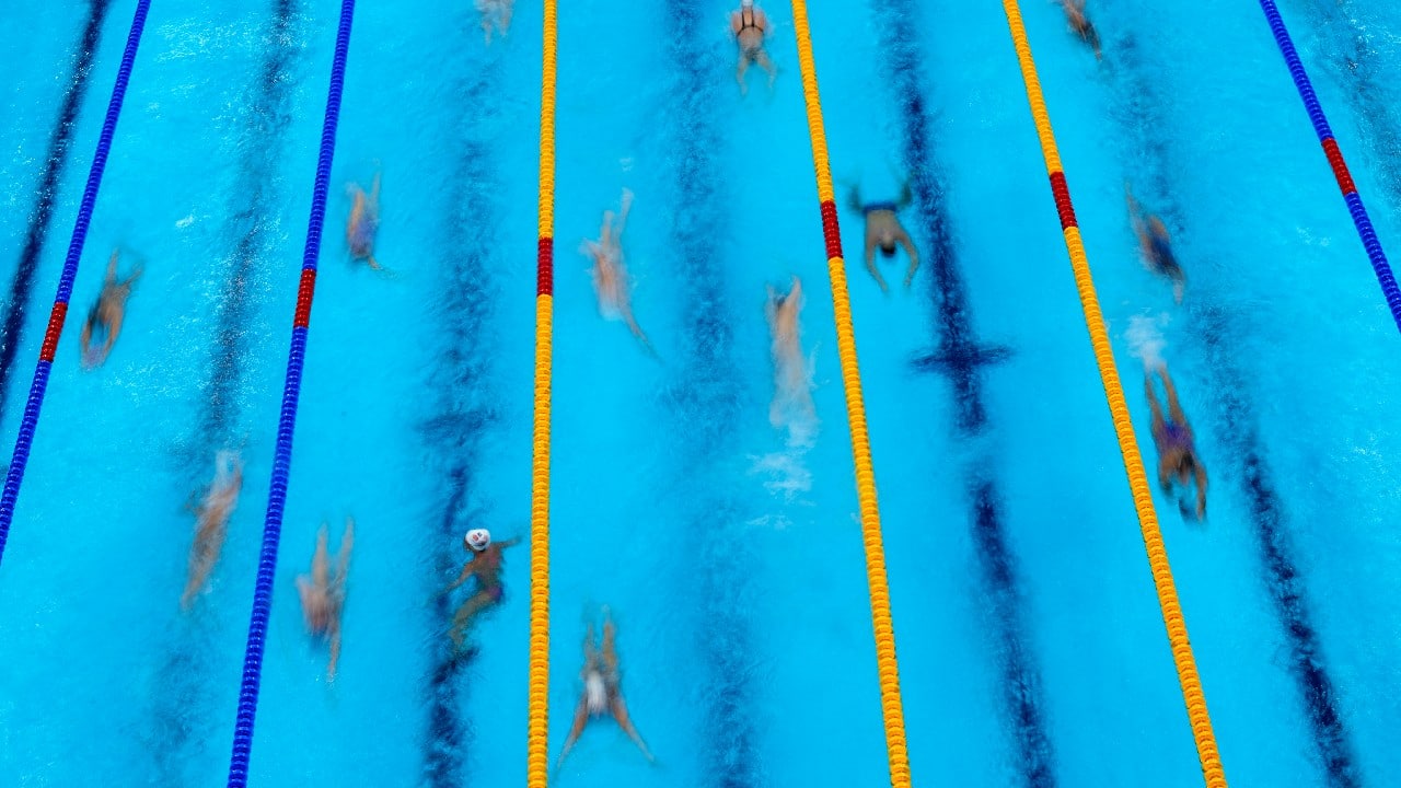 Using joy sticks and remote viewing monitors, AP photographers can capture the precision required to clear the high bar, the speed at which divers fall toward the water or the agony of a lifter who failed to raise her weight. (Image: AP)