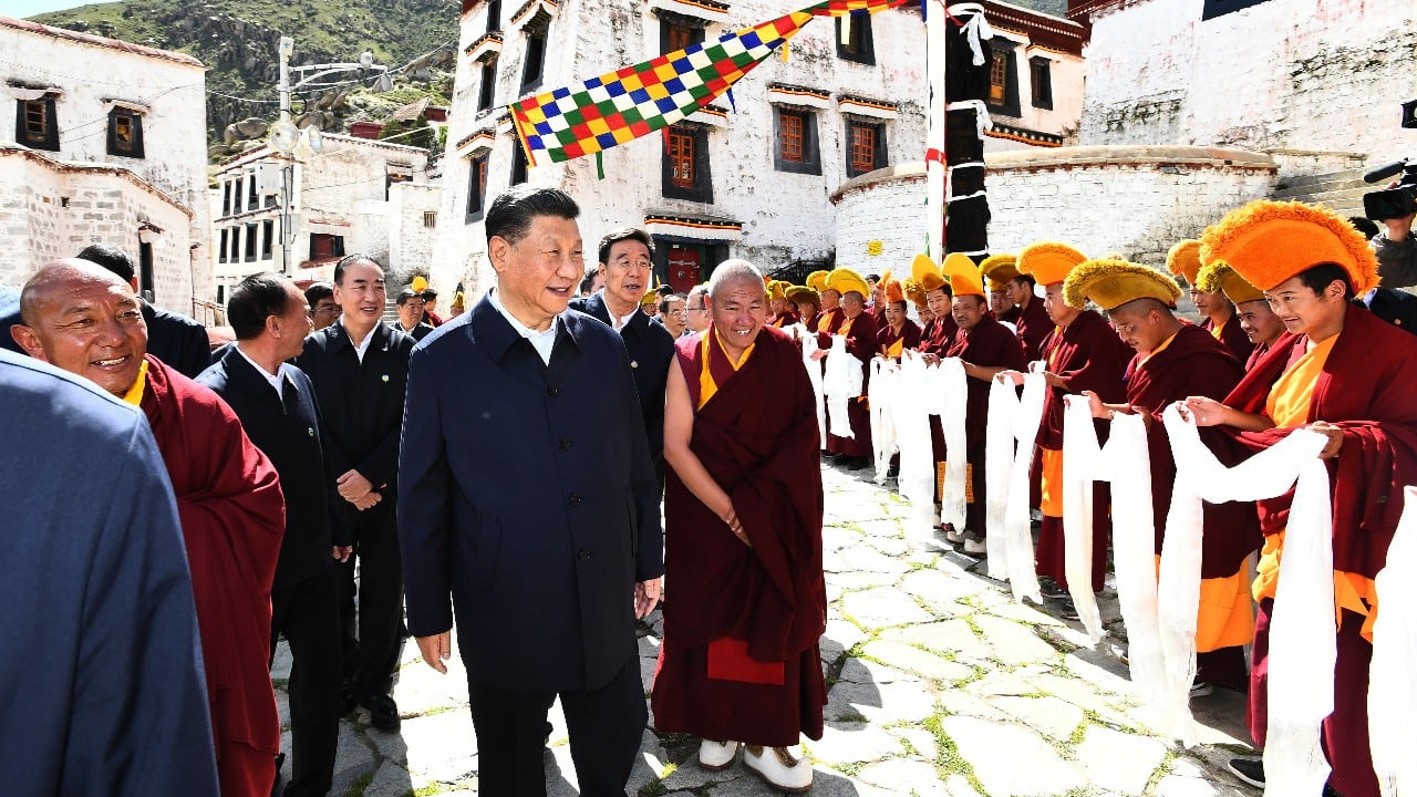 In this photo released by Xinhua News Agency, Chinese President Xi Jinping, visits the Drepung Monastery located in the western suburbs of Lhasa, southwestern China's Tibet Autonomous Region on July 22. Xi made a rare visit to Tibet as authorities tighten controls over the Himalayan region's traditional Buddhist culture, accompanied by an accelerated drive for economic development. (Image: AP)