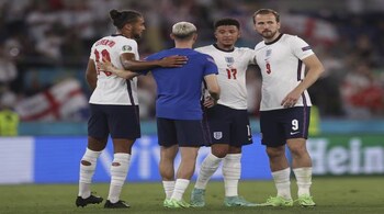 England's Dominic Calvert-Lewin, left, England's Phil Foden, second letft, England's Jadon Sancho, second right, and England's Harry Kane celebrate at the end of the Euro 2020 soccer championship quarterfinal soccer match between Ukraine and England at the Olympic stadium, in Rome, Italy, Saturday, July 3, 2021. England won 4-0. (Lars Baron/Pool Photo via AP)