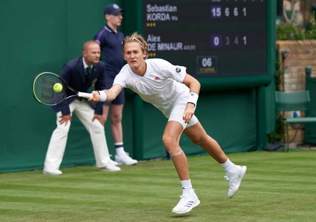 Jun 29, 2021; London, United Kingdom; Sebastian Korda (USA) seen playing Alex de Minaur (AUS) in first round singles on No. 17 court at All England Lawn Tennis and Croquet Club. Mandatory Credit: Peter Van den Berg-USA TODAY Sports - 16334956