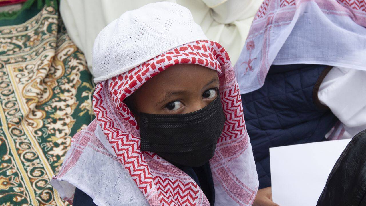 A muslim child gather for prayers to celebrate Eid al-Adha, or Feast of Sacrifice, that commemorates the Prophet Ibrahim's faith in Nairobi, Kenya, Tuesday, July 20, 2021. Eid al-Adha marks the end of hajj. (AP Photo/Sayyid Abdul Azim)