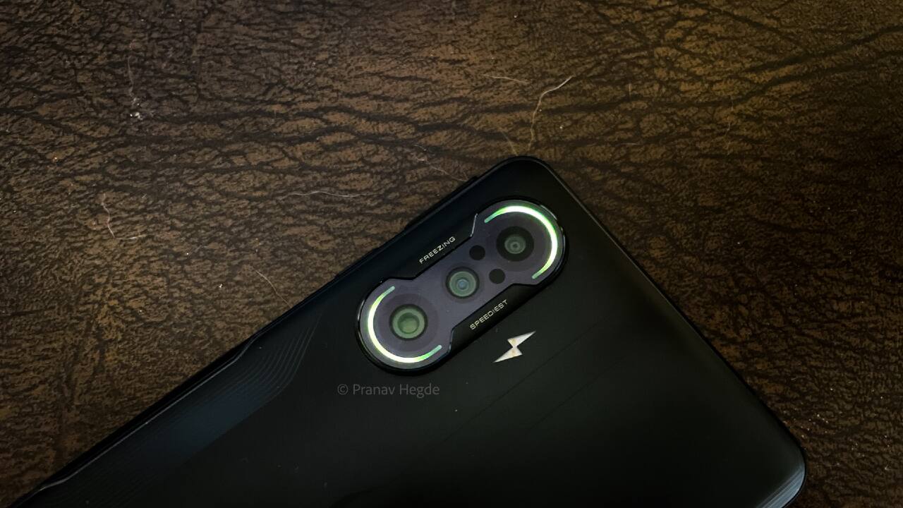 Battery life and charging: The 5,065 mAh cell can survive and offer an all-day battery life, even when you play games for like a couple of hours. Expect a screen-on time of up to 6 hours on a single charge with 120Hz enabled. The device comes with a 67W fast charger in the box to refuel the battery from zero to hundred in about 50 minutes. It also comes with support for USB PD charging. We used Stuffcool’s 65W GaN charger for the same, and the device took about an hour and 15 mins to charge completely. Not bad, if you ask us. Oh, by the way. The camera module has a couple of RGB LEDs that light up when you put the phone on charge to give a gamer phone look. Battery life and charging: The 5,065 mAh cell can survive and offer an all-day battery life, even when you play games for like a couple of hours. Expect a screen-on time of up to 6 hours on a single charge with 120Hz enabled. The device comes with a 67W fast charger in the box to refuel the battery from zero to hundred in about 50 minutes. It also comes with support for USB PD charging. We used Stuffcool’s 65W GaN charger for the same, and the device took about an hour and 15 mins to charge completely. Not bad, if you ask us. Oh, by the way. The camera module has a couple of RGB LEDs that light up when you put the phone on charge to give a gamer phone look.