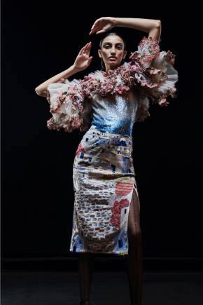 From Rahul Mishra's Paris Haute Couture Week 2021 collection The Shape of Air. Embroidered in clusters on the swirling appliquéd garments are the unmistakable buildings and the unique cityscape.