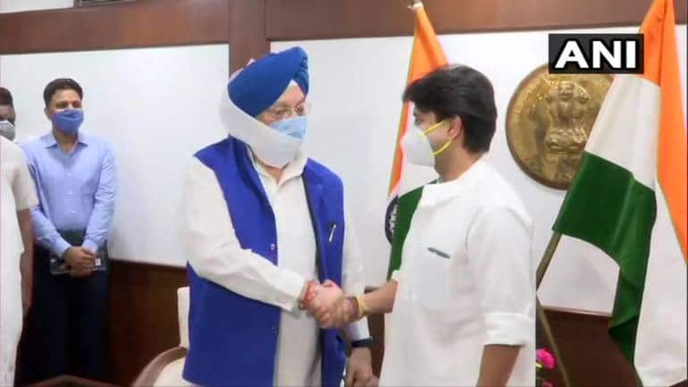 Jyotiraditya Scindia takes charge as the Minister of Civil Aviation in the presence of former Aviation Minister Hardeep Singh Puri.