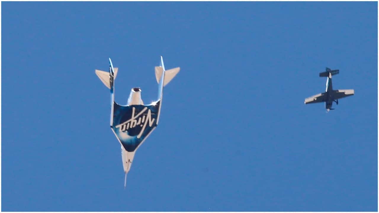 The brief, up-and-down flight — the rocket ship’s portion took only about 15 minutes, or about as long as Alan Shepard’s first U.S. spaceflight in 1961 — was an splashy and unabashedly commercial plug for Virgin Galactic, which plans to start taking paying customers on joyrides next year. In this picture rocket plane VSS Unity descends after reaching the edge of space. REUTERS/Joe Skipper