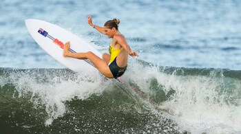 Seven-time World Surfing League World Tour champion, Australia's Stephanie Gilmore rides a wave during a training session at the 2020 Summer Olympics at Tsurigasaki beach in Ichinomiya, Japan on July 22. (
Image: AP)