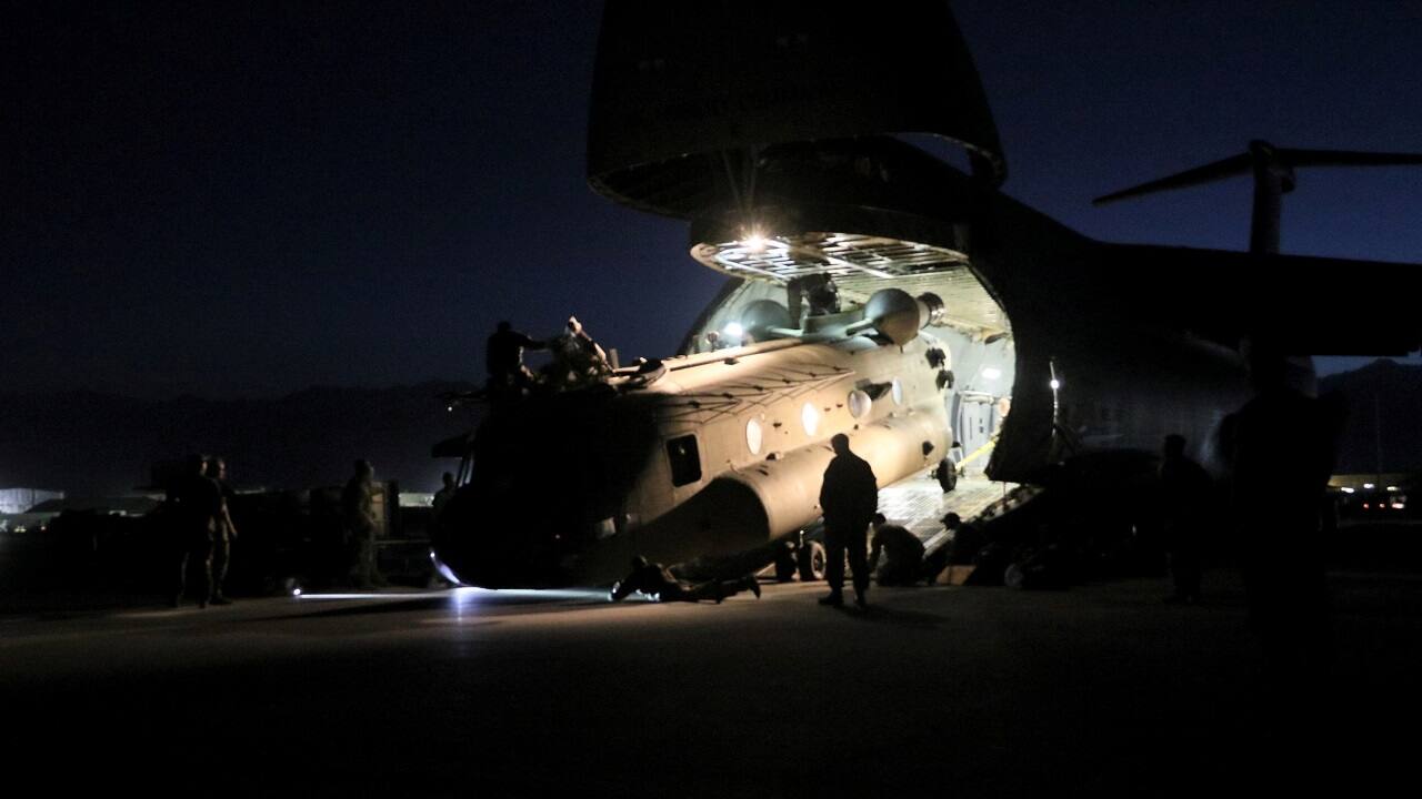 Aerial porters work with maintainers to load a CH-47 Chinook helicopter into a US Air Force C-17 Globemaster III as American forces withdraw from Afghanistan, on June 16, 2021 (Image: US Army/Sgt. 1st Class Corey Vandiver/Handout via Reuters)