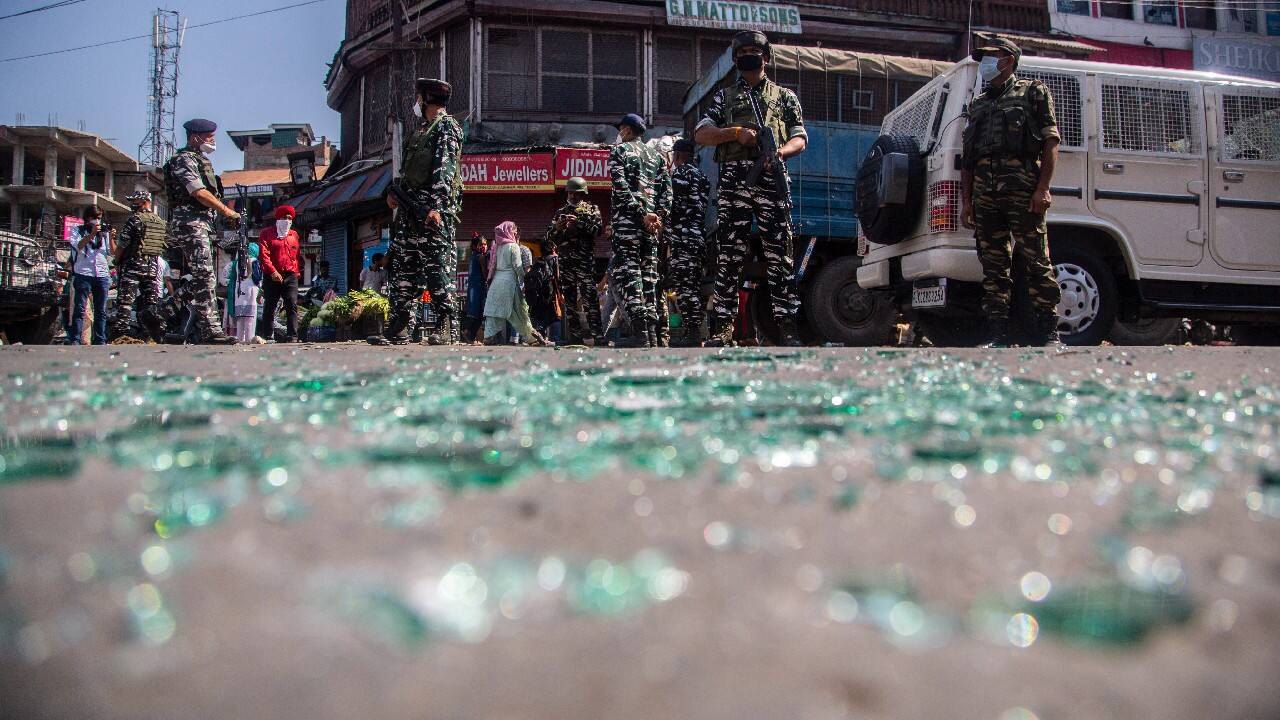 Indian paramilitary soldiers keep guard near the site of a grenade attack in a market area in Srinagar, Kashmir. Several civilians were injured in the grenade attack which police have blamed on rebels fighting against Indian rule. (Image: AP)