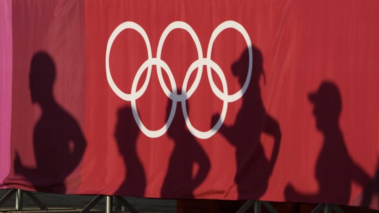 Athlete's shadows are cast on a curtain during the men's 50 kilometer race walk at the 2020 Summer Olympics, Friday, Aug. 6, 2021, in Sapporo, Japan. (Image: AP)