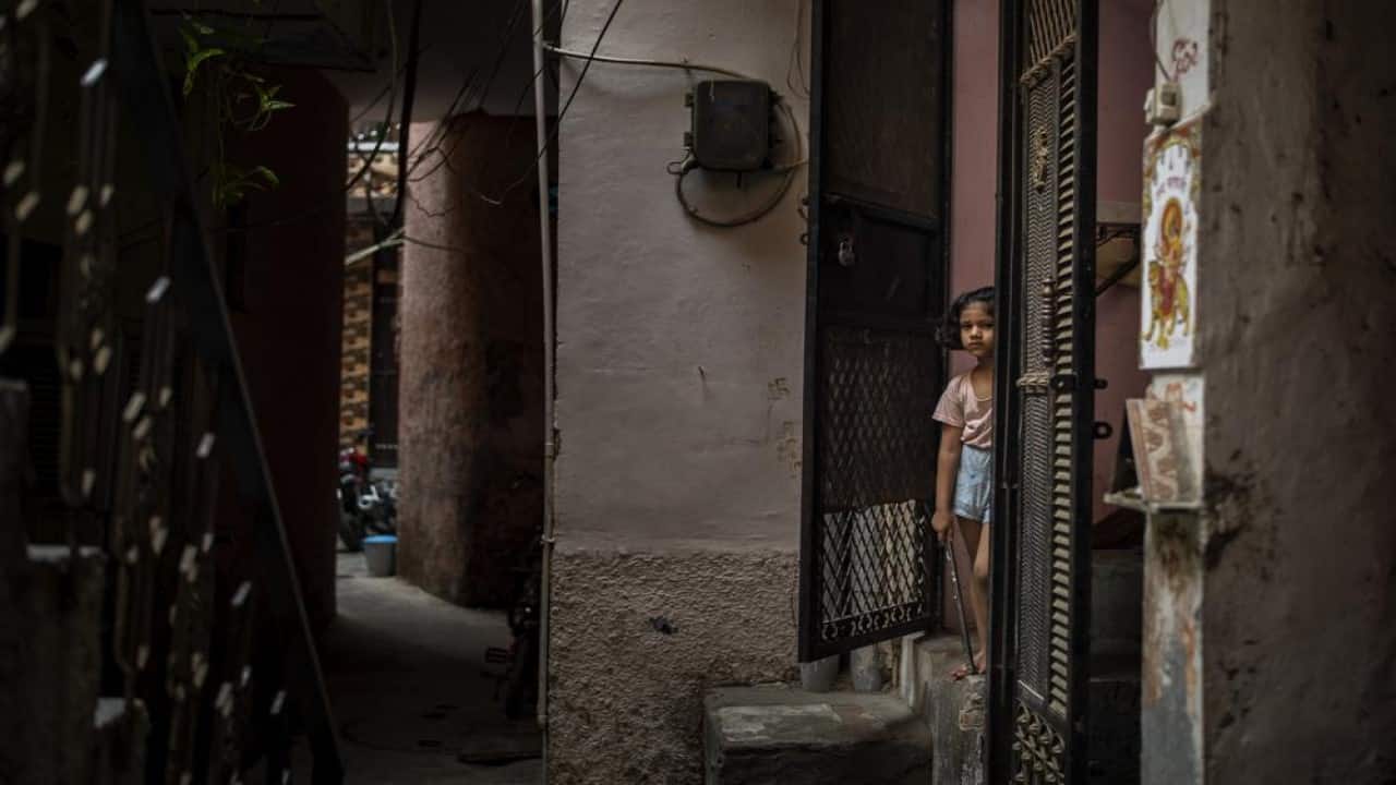 A young girl stands at the entrance of her house next to the house of a 9-year-old girl from the lowest rung of India's caste system who, according to her parents and protesters, was raped and killed earlier this week, in New Delhi, India, Thursday, Aug. 5, 2021. Rape and sexual violence have been under the spotlight in India since the 2012 gang rape and killing of a 23-year-old student on a New Delhi bus. The attack sparked massive protests and inspired lawmakers to order the creation of fast-track courts dedicated to rape cases and stiffen penalties for those convicted of the crime. (Image: AP)