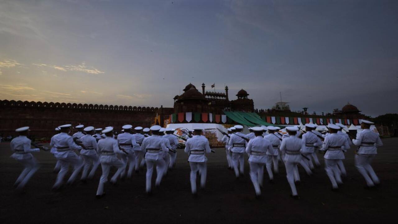 Navy sailors warm up before the start of full dress rehearsals for Independence Day celebrations at the historic 17th century Red Fort in New Delhi, India, on Friday, Aug. 13, 2021. India commemorates its 1947 independence from British colonial rule on August 15. (Image: AP)