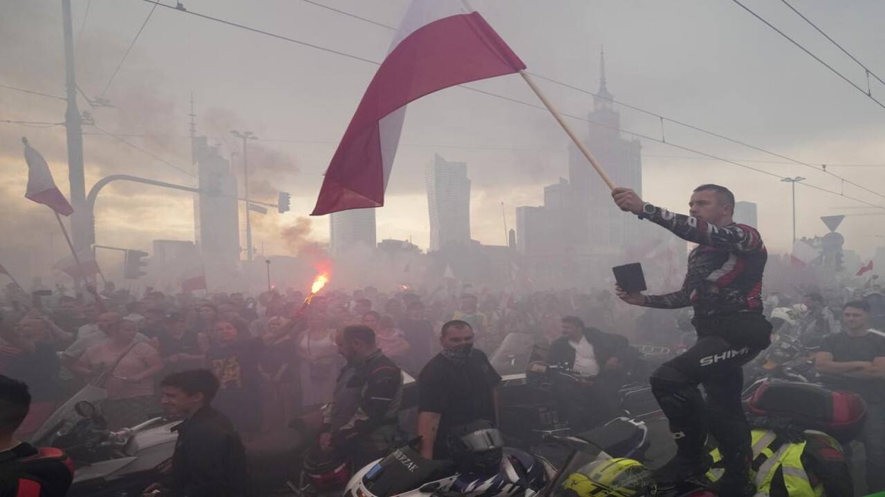 Residents with torches in national white-and-red colors gather to mark the 77th anniversary of the start of the 1944 Warsaw Rising, an ill-fated heroic struggle of the resistance fighters and the city resident against the occupying Nazi Germans, in Warsaw, Poland, Sunday, Aug. 1, 2021. Some 10,000 fighters and up to 200,000 residents were killed in the two-months of struggle and German bombings. The Germans expelled the remaining residents and destroyed the city. (Image: AP)