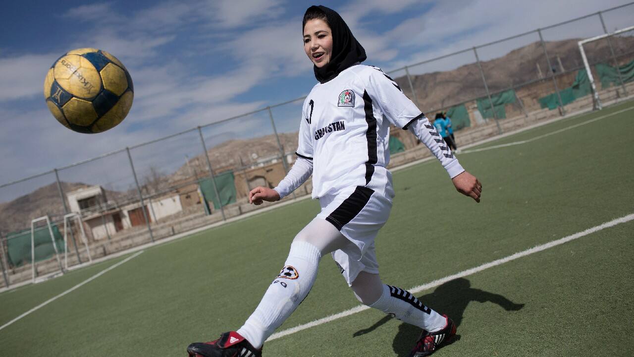 A female soccer player controls a ball during a training session at the Golab Trust Sport Complex in Kabul March 10, 2014. Despite decades of conflict in Afghanistan, and several recent militant attacks, the country's capital Kabul is home to a vibrant youth scene of musicians, artists, athletes and activists. Shopping malls and cafes stand in the city, which is nonetheless beset by infrastructure problems and instability. Afghanistan is preparing for an election on April 5 that should mark the first democratic transfer of power in the country's history, but it has been hit by a tide of violence as the Islamist Taliban movement has ordered its fighters to disrupt the vote and threatened to kill anyone who participates. (Image: Reuters)