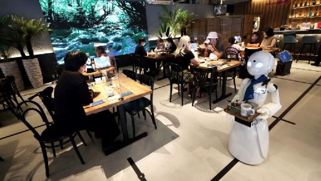The cafe opened in central Tokyo's Nihonbashi district in June and employs staff across Japan and overseas, as well as some who work on site. It was originally supposed to open last year to coincide with the Paralympics, but the opening was postponed by the pandemic -- just like the Games, which begin on August 24. (Image: AFP)