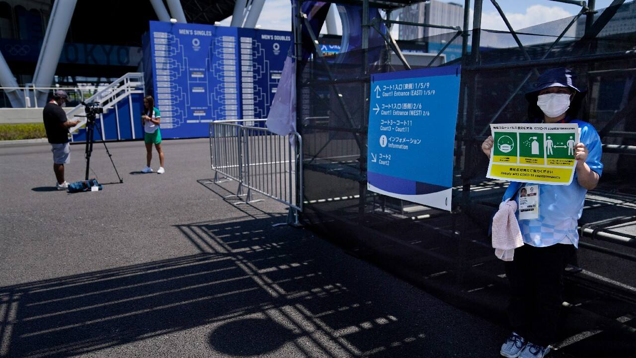 Reminders are everywhere that these will forever be remembered as the Pandemic Olympics. (Image: AP)