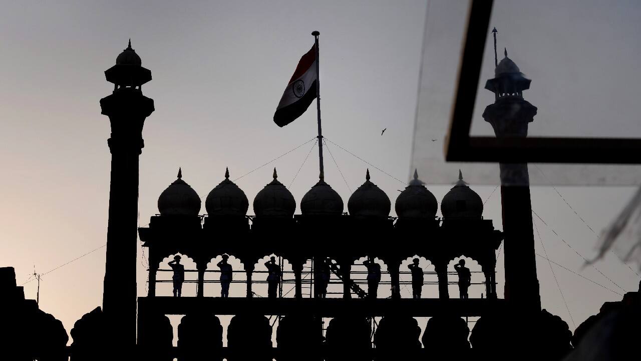 A bird flies as buglers from joint military forces play standing on the arches of the historic 17th century Red fort during full dress rehearsals of Independence Day celebrations in New Delhi, India, August 13. India commemorates its Independence in 1947 from British colonial rule, on August 15. (Image: AP)