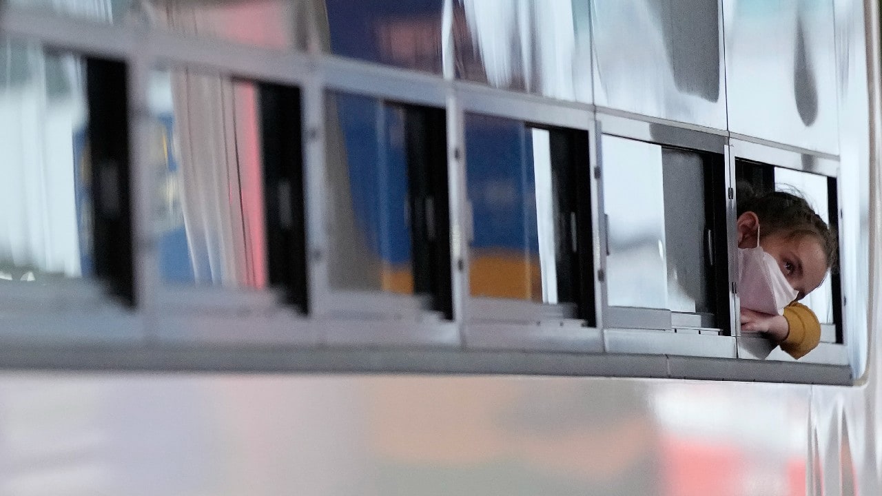 An Afghan girl in a bus waits to leave after arriving with her family at the Incheon International Airport, South Korea, August 26. (Image: AP)