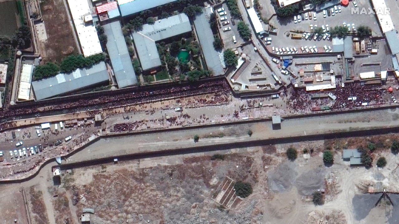 The US military pulled off its biggest day of evacuation flights out of Afghanistan by far on August 23, but deadly violence that has blocked many desperate evacuees from entering Kabul's airport persisted, and the Taliban signaled they might soon seek to shut down the airlifts. (Image: Satellite image ©2021 Maxar Technologies/AP)