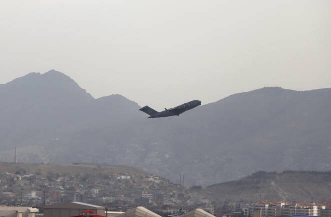 A U.S military aircraft takes off from the Hamid Karzai International Airport in Kabul, Afghanistan, Monday, Aug. 30, 2021. (AP Photo/Wali Sabawoon)