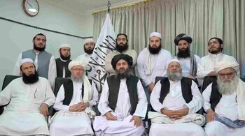 Mullah Baradar Akhund, a senior official of the Taliban, seated with a group of men, makes a video statement, in this still image taken from a video recorded in an unidentified location and released on August 16. (Representative image: Reuters)