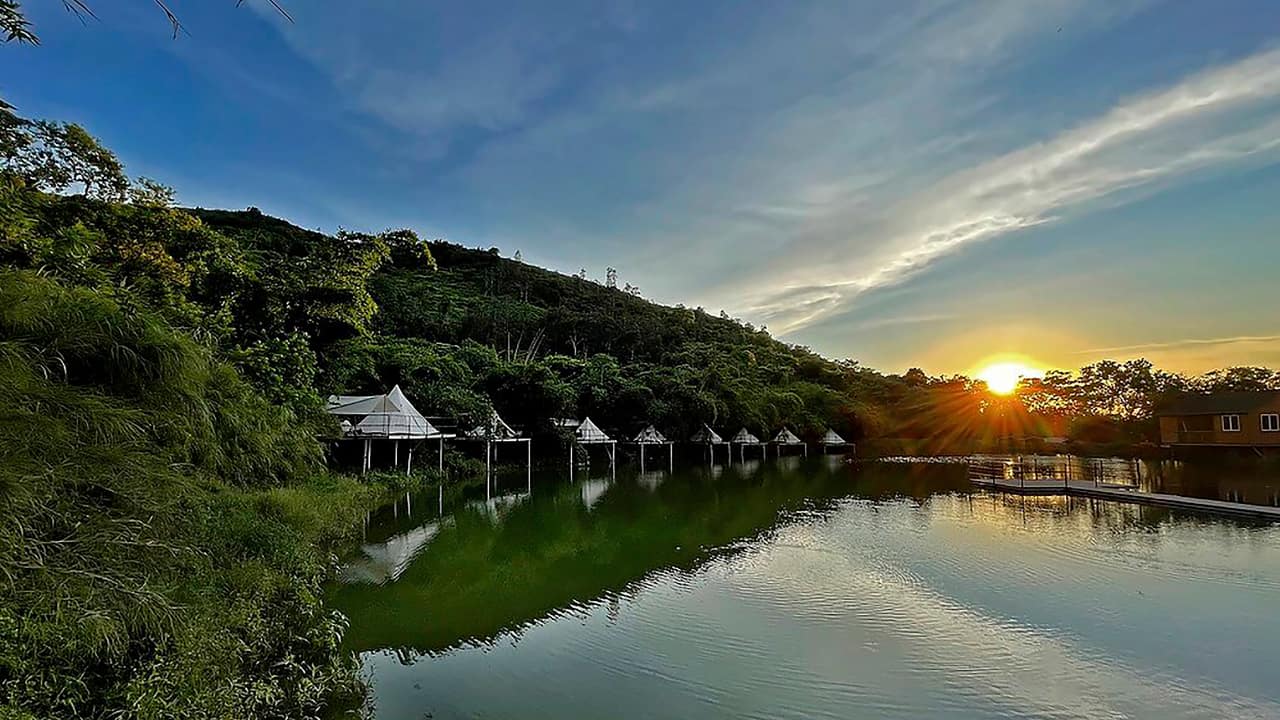 Indiana-style tents are seen during sunset at We Camp, a glamping site located in Yuen Long, Hong Kong. (AP Photo/Katie Tam)