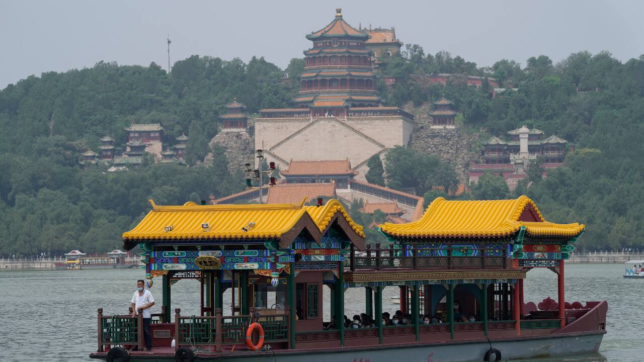 A ferry transports tourists visiting the Summer Palace in Beijing. (AP Photo/Ng Han Guan)