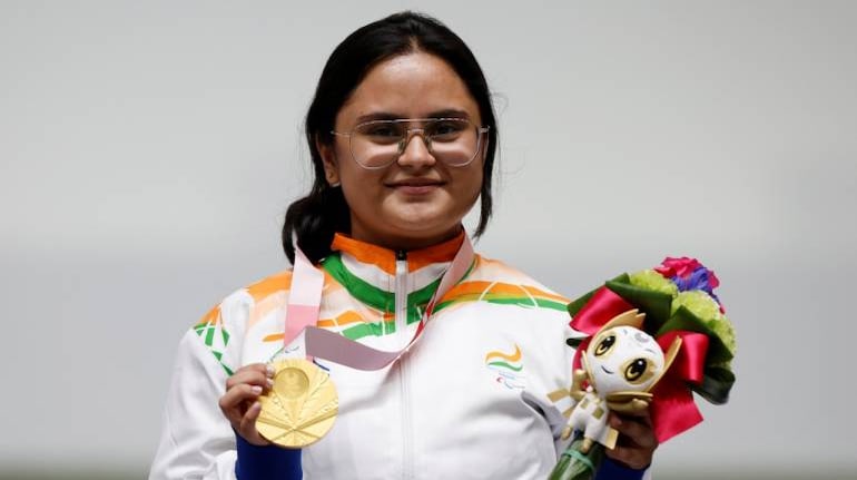 India's Avani Lekhara celebrates on the podium after a clinching a gold medal in the Women's 10m Air Rifle Standing SH1 event at the Tokyo Paralympics. (Image: REUTERS/Issei Kato)