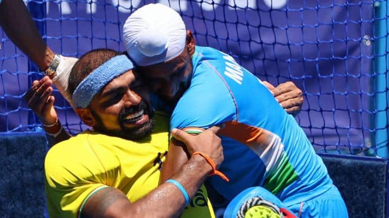 Sreejesh Parattu Raveendran of India and Mandeep Singh of India celebrate winning their match for bronze. (Image: Reuters/Hamad I Mohammed)