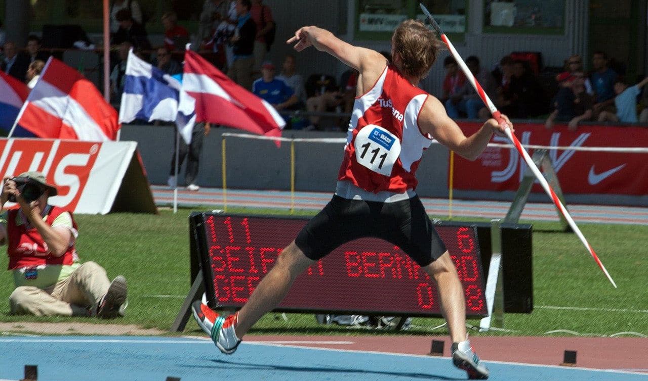 Components of javelin throw: Notice the American grip of the thrower and the exaggerated crossover step as he prepares to launch the javelin.