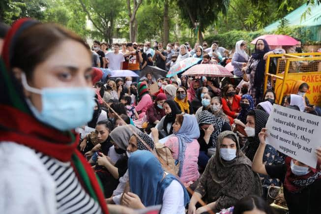 People protest outside an United Nations High Commissioner for Refugees (UNHCR) office to urge the international community to help Afghan refugees, in New Delhi, India, August 23, 2021. REUTERS/Anushree Fadnavis - RC2WAP97T0PZ