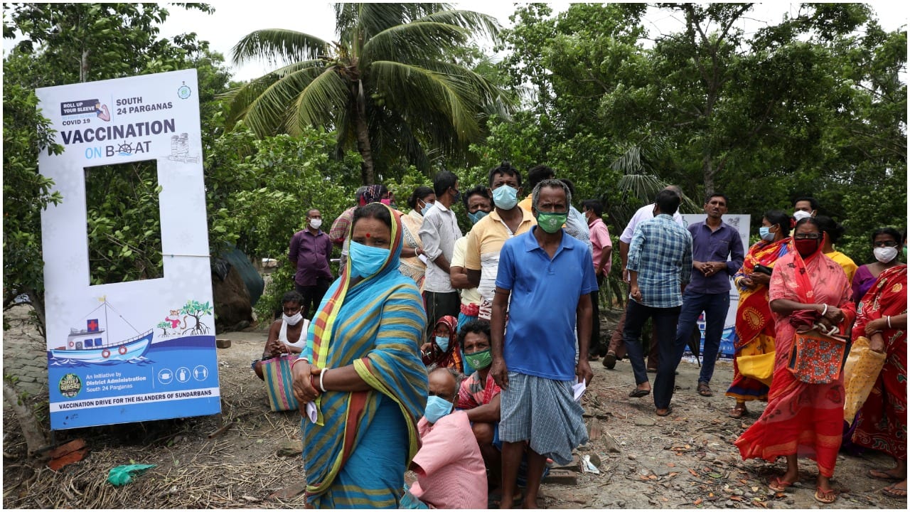 Villagers wait to receive a dose of COVISHIELD vaccine, a coronavirus disease (COVID-19) vaccine manufactured by Serum Institute of India, during "Vaccination on boat" programme in Gosaba Island in the eastern state of West Bengal, India, July 12, 2021. REUTERS/Rupak De Chowdhuri