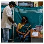 Minakshamma, 68, receives a dose of COVISHIELD, a coronavirus disease (COVID-19) vaccine manufactured by Serum Institute of India, at a vaccination centre in Bengaluru, May 13, 2021. REUTERS/Samuel Rajkumar.