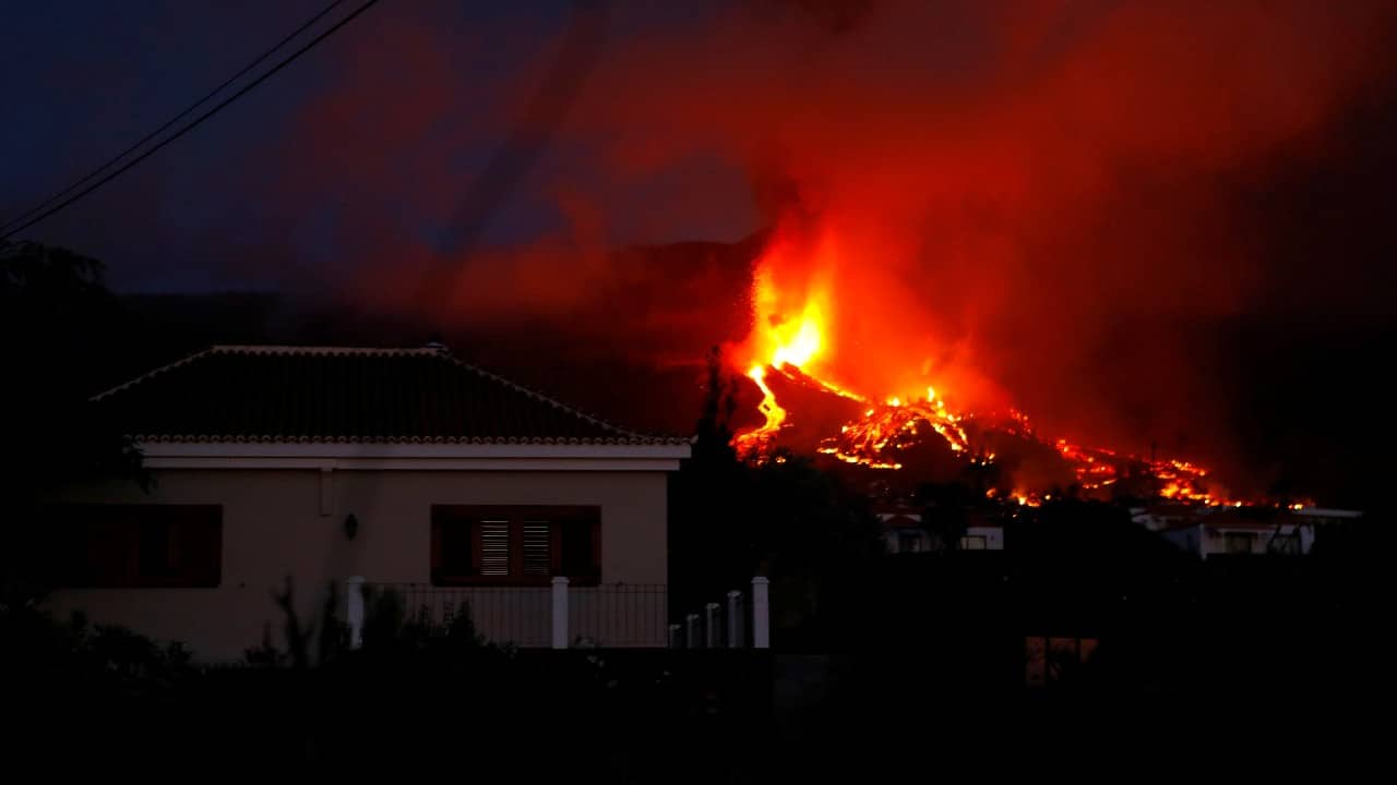 Lava flows next to a house following the eruption of a volcano in the Cumbre Vieja national park at El Paso, on the Canary Island of La Palma. (Image: Reuters)