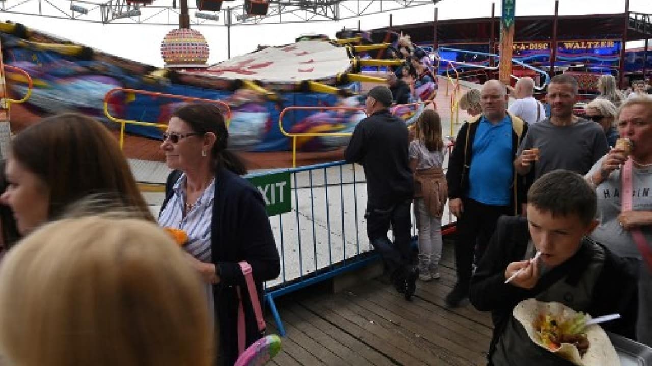 Blackpool restaurant owner Alex Lonorgan, 37, has enjoyed two busy summers in a row amid the hardship of three pandemic-enforced closures since March 2020. "It's been amazing that so many families have had something different by having a UK holiday -- Blackpool is going to be back on everybody's map," he said. (Image: AFP) , Domestic tourism boom gives UK seaside new lease of life amid COVID-19 blues, The World Live Breaking News Coverage & Updates IN ENGLISH