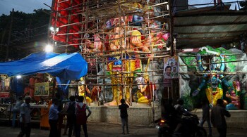 People look at a giant idol Ganesha ahead of Ganesh Chaturthi festival in Hyderabad. (Image: AP)