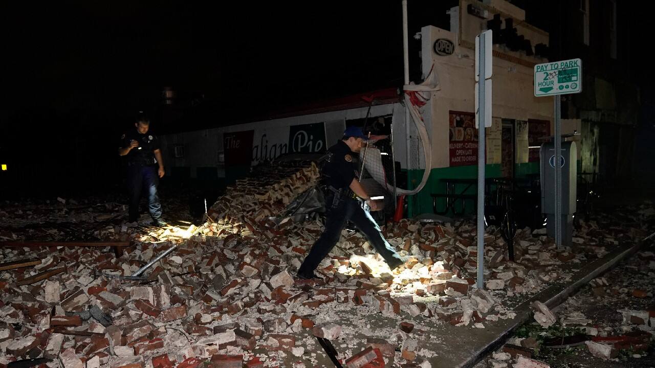 Police look through debris after a building collapsed from the effects of Hurricane Ida, August 30, in New Orleans, La. (Image: AP)