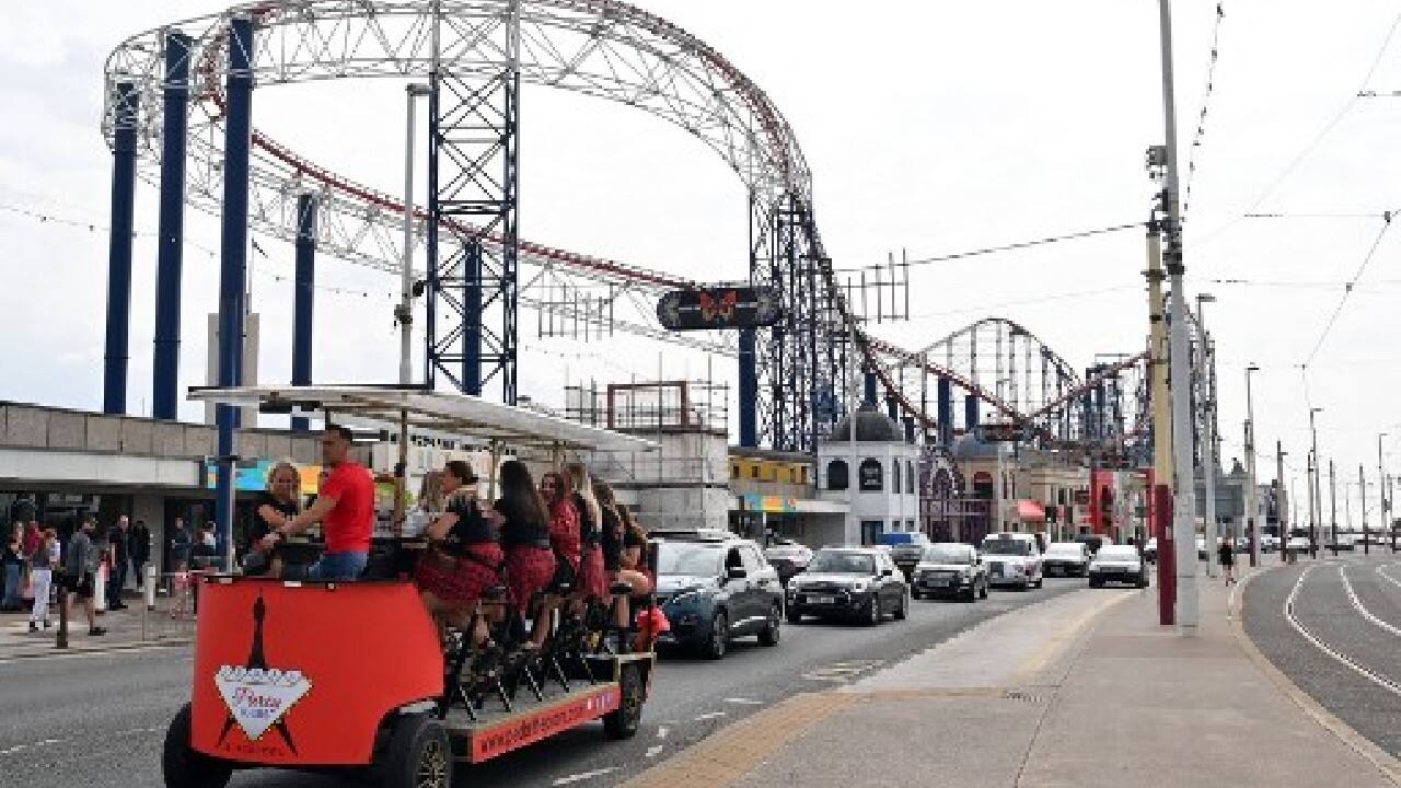 Once synonymous with leisure and pleasure, Blackpool became a byword for decline and poverty. A 2019 UK government study found Blackpool had eight of England's 10 most deprived neighbourhoods. And its historic dependence on tourism and hospitality meant the coronavirus pandemic dealt a devastating blow to the town's economy and vulnerable social groups. (Image: AFP) , Domestic tourism boom gives UK seaside new lease of life amid COVID-19 blues, The World Live Breaking News Coverage & Updates IN ENGLISH