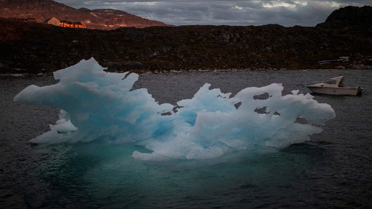 An iceberg passes by during sunset in Nuuk, Greenland. (Image: Reuters)