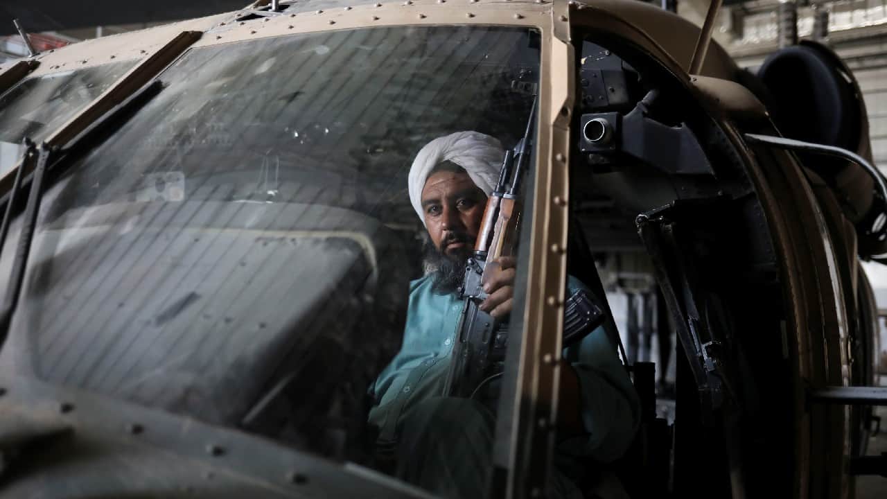 Vahdat, a Taliban soldier and former prisoner, sits in a military helicopter at Bagram Air Base in Parwan, Afghanistan, September 23. (Image: Reuters)