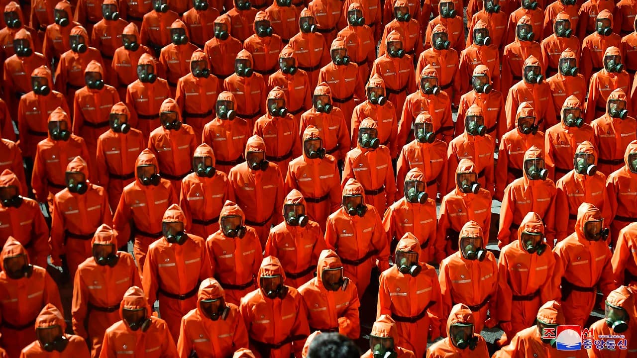 The KCNA described Red Guards units from Pyongyang and other regions marching through the square in order and praised them for their supposedly huge contributions in rebuilding communities destroyed by natural disasters and efforts to improve the economy. The marchers also included workers from the Ministry of Public Health involved in the country’s anti-virus campaign, who the KCNA credited for “firmly protecting the security of the country and its people from the worldwide pandemic.” (Image: Korean Central News Agency/Korea News Service via AP)