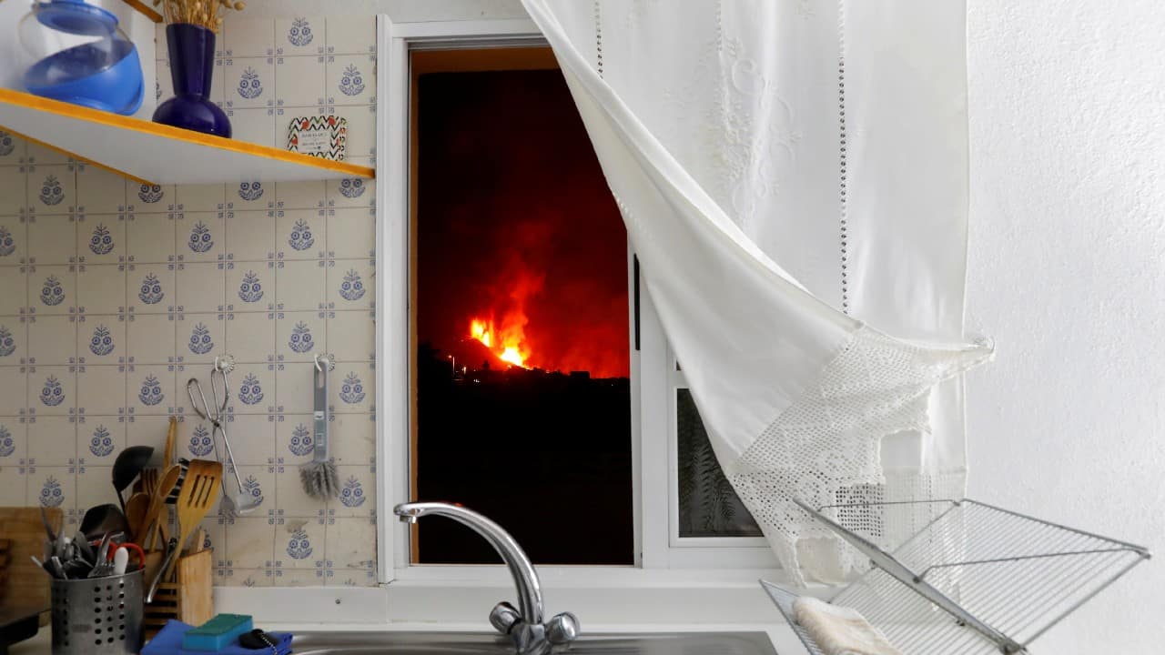 Lava is seen through the window of a kitchen from El Paso following the eruption of a volcano on the Canary Island of La Palma, Spain. (Image: Reuters) Lava is seen through the window of a kitchen from El Paso following the eruption of a volcano on the Canary Island of La Palma, Spain. (Image: Reuters)