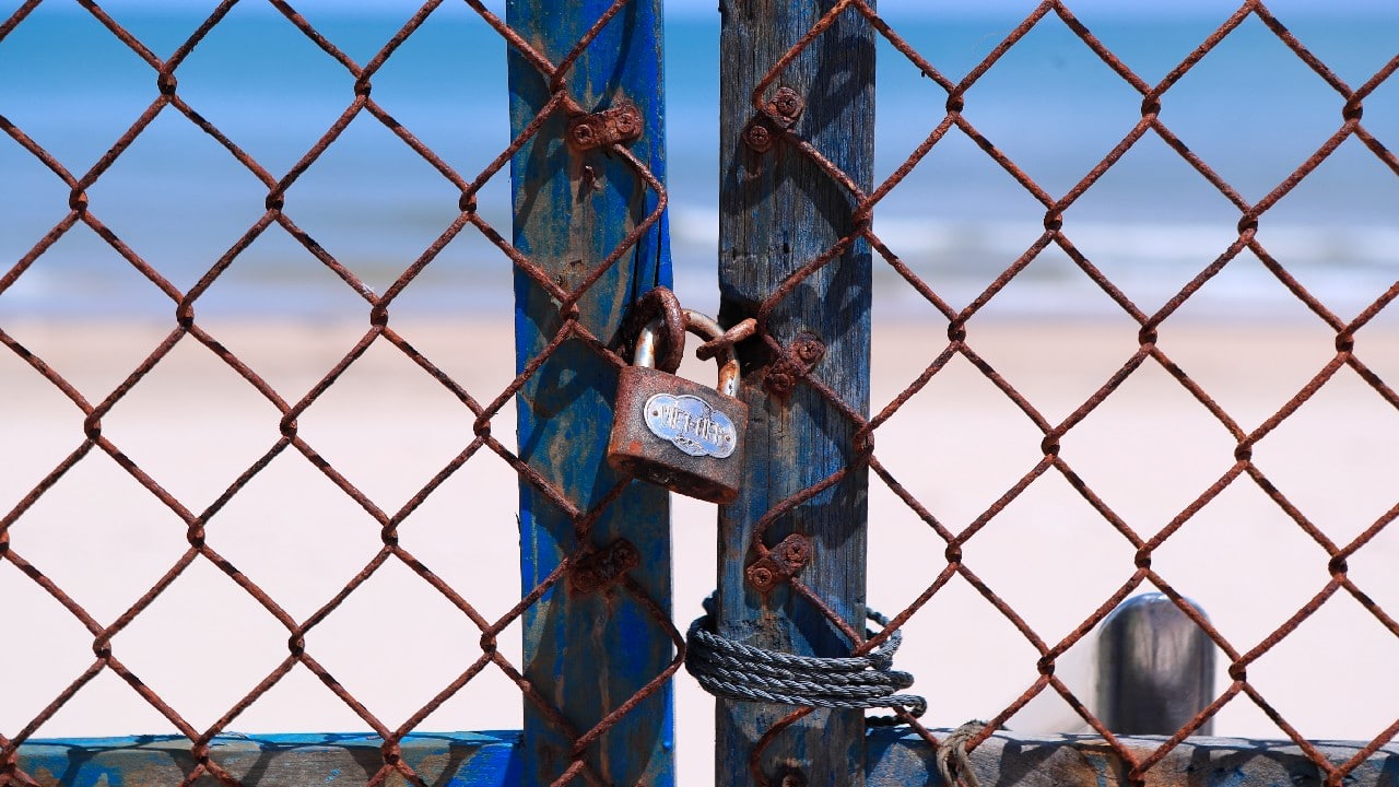 Entrance to a beach is barricaded and locked in Vung Tau, Vietnam. The roadblocks and barricades make the streets of this southern Vietnamese city look like they did during the war that ended almost 50 years ago. But this time, the battle is being fought against the rampaging coronavirus. (Image: AP)