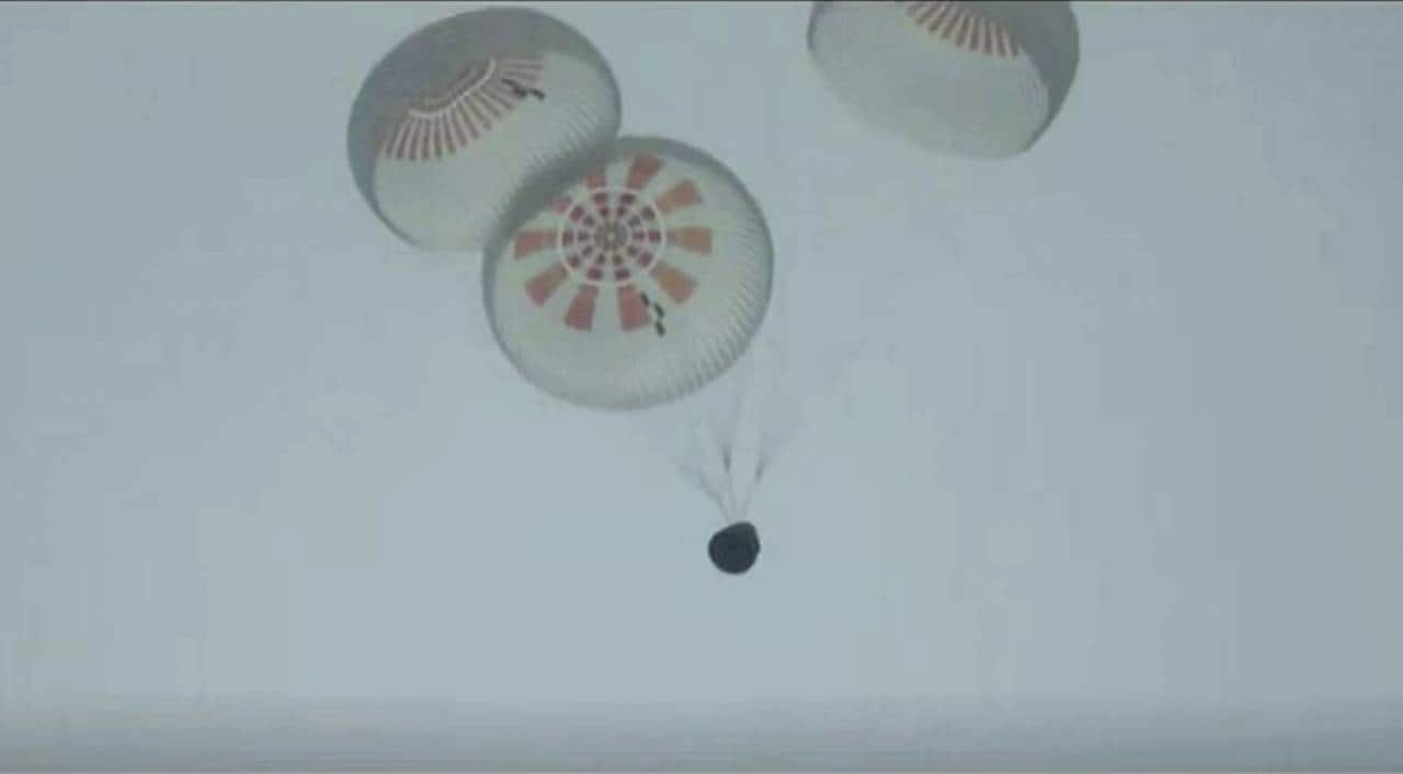 In this image taken from SpaceX video a SpaceX capsule carrying four people parachutes into the Atlantic Ocean off the Florida coast, Saturday, Sept. 18, 2021. The all-amateur crew was the first to circle the world without a professional astronaut. (SpaceX via AP) In this image taken from SpaceX video a SpaceX capsule carrying four people parachutes into the Atlantic Ocean off the Florida coast, Saturday, Sept. 18, 2021. The all-amateur crew was the first to circle the world without a professional astronaut. (SpaceX via AP)