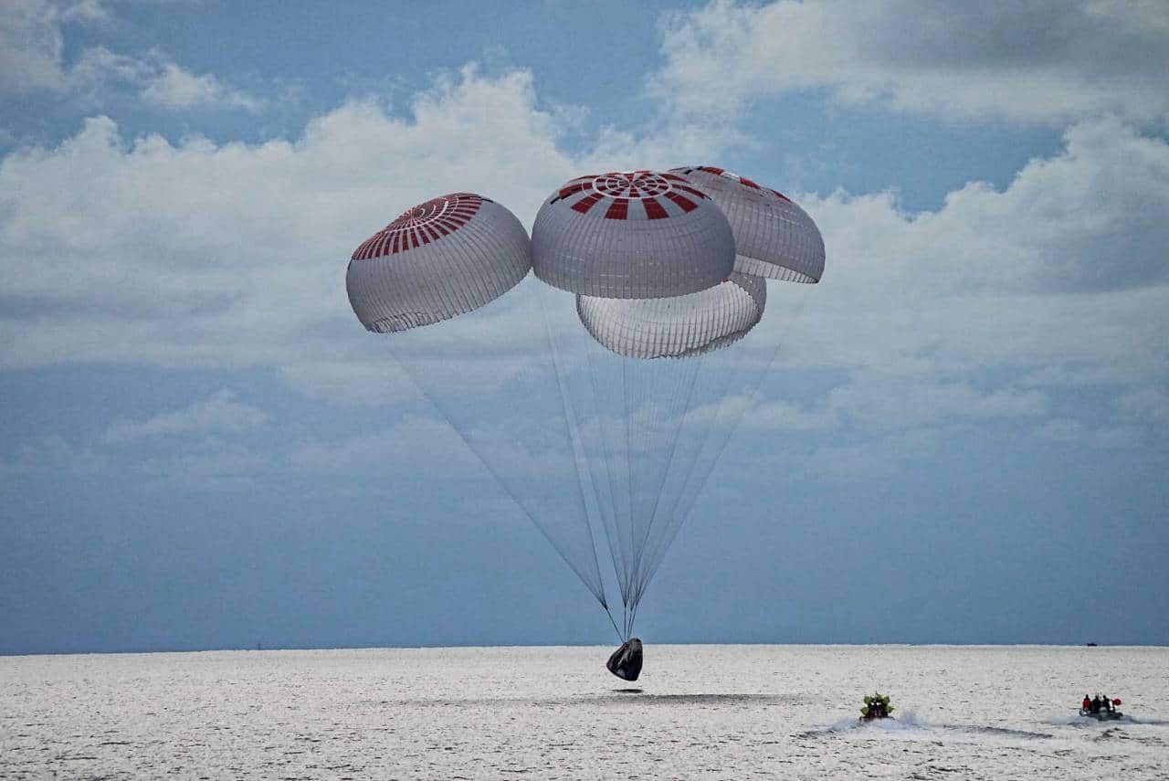 In this image taken provided by SpaceX, a capsule carrying four people parachutes into the Atlantic Ocean off the Florida coast, Saturday, Sept. 18, 2021. The all-amateur crew was the first to circle the world without a professional astronaut. (SpaceX via AP) In this image taken provided by SpaceX, a capsule carrying four people parachutes into the Atlantic Ocean off the Florida coast, Saturday, Sept. 18, 2021. The all-amateur crew was the first to circle the world without a professional astronaut. (SpaceX via AP)
