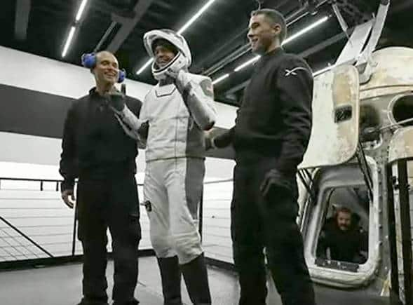 In this image taken from video, Jared Isaacman, one of four passengers aboard the SpaceX capsule, reacts after emerging from the capsule Saturday, Sept. 18, 2021, after it was recovered following its splashdown in the Atlantic off the Florida coast. The all-amateur crew was the first to circle the world without a professional astronaut. (Inspiration4 via AP) In this image taken from video, Jared Isaacman, one of four passengers aboard the SpaceX capsule, reacts after emerging from the capsule Saturday, Sept. 18, 2021, after it was recovered following its splashdown in the Atlantic off the Florida coast. The all-amateur crew was the first to circle the world without a professional astronaut. (Inspiration4 via AP)