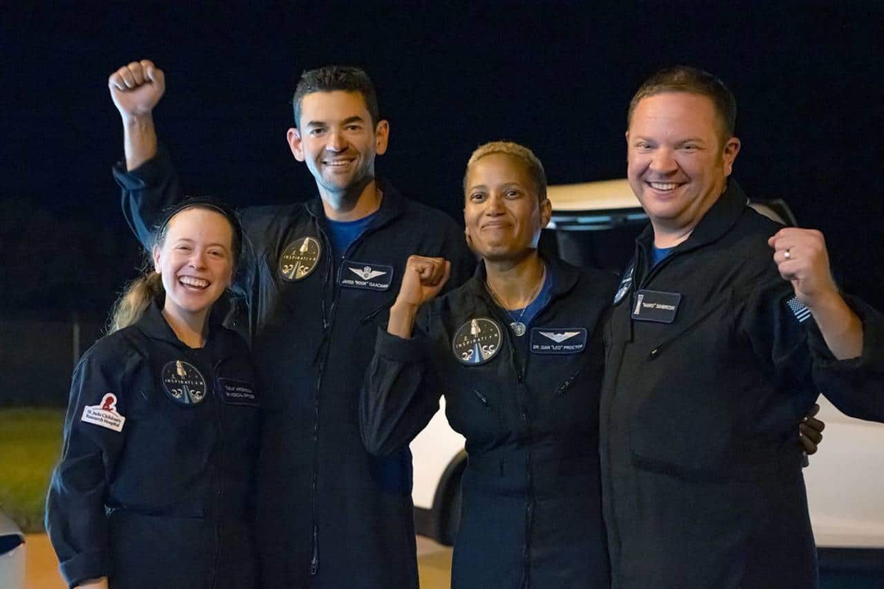 In this image released by Inspiration4, passengers aboard a SpaceX capsule, from left to right, Hayley Arceneaux, Jared Isaacman, Sian Proctor and Chris Sembroski pose after the capsule was recovered following its splashdown in the Atlantic off the Florida coast, Saturday, Sept. 18, 2021. The all-amateur crew was the first to circle the world without a professional astronaut. (John Kraus/Inspiration4 via AP) In this image released by Inspiration4, passengers aboard a SpaceX capsule, from left to right, Hayley Arceneaux, Jared Isaacman, Sian Proctor and Chris Sembroski pose after the capsule was recovered following its splashdown in the Atlantic off the Florida coast, Saturday, Sept. 18, 2021. The all-amateur crew was the first to circle the world without a professional astronaut. (John Kraus/Inspiration4 via AP)